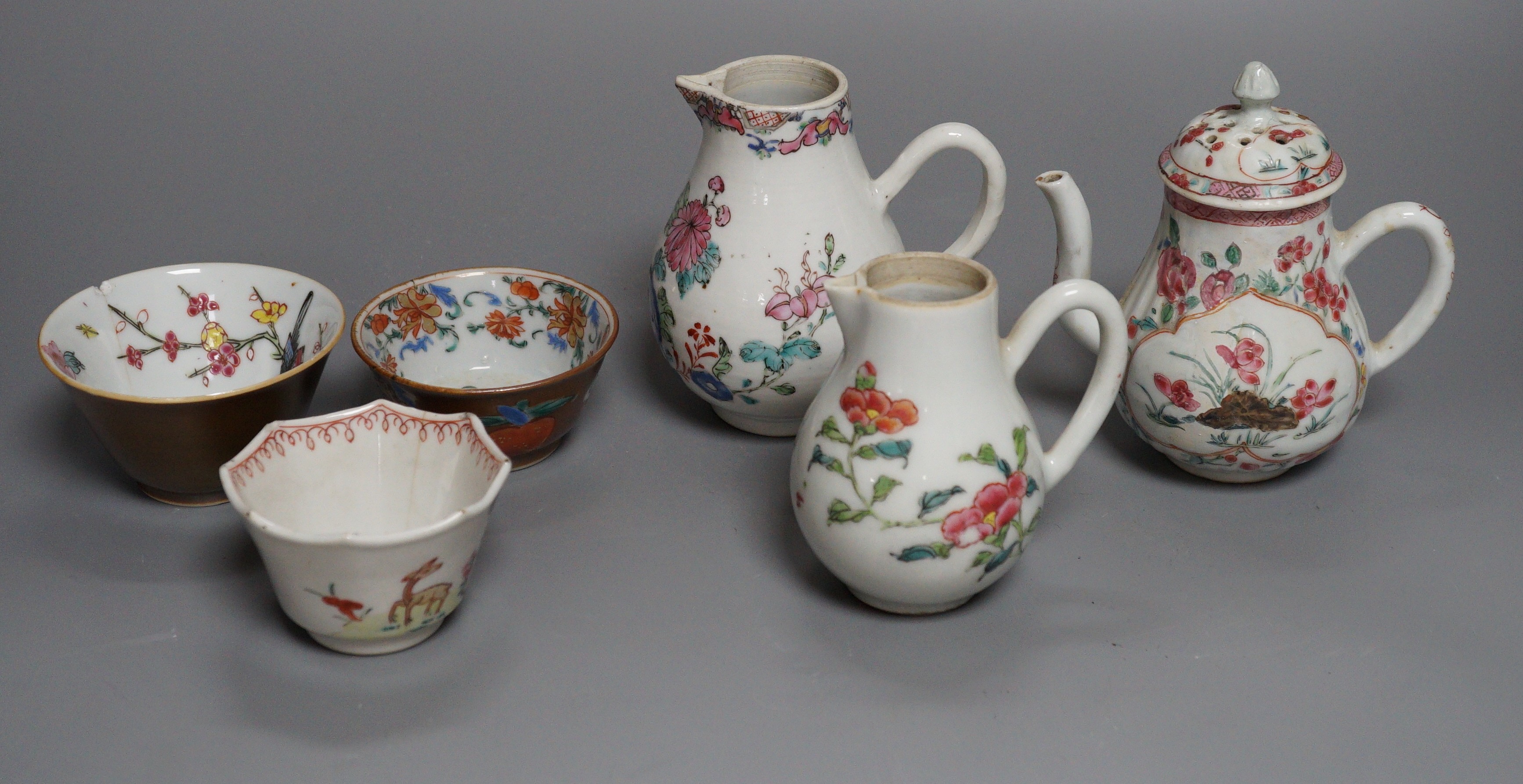 Three Chinese export famille rose cream jugs, one with pierced cover and three small bowls, 18th century and later